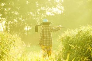 The farmer is going to the field in the morning. photo