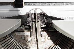 typebar types ink ribbon in old typewriter photo