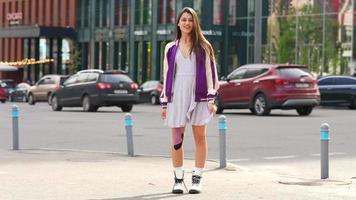 Girl wearing purple dress on the street on a sunny day video