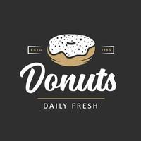 Vintage style bakery shop simple label, badge, emblem, logo template. Graphic food art with engraved doughnut design vector element with typography. Linear organic donut on black background.