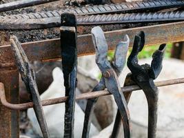 forge tongs in country outdoor blacksmith photo
