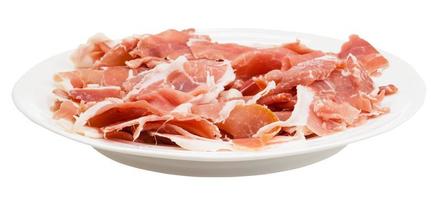 side view of thin sliced dry-cured ham on plate photo