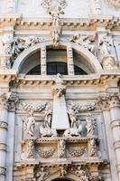 statue of Vincenzo Fini on facade church photo