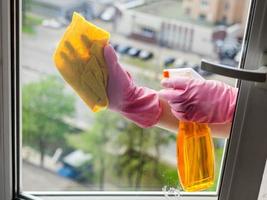 cleaner cleans window glass with detergent photo