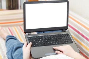 man read on laptop with cut out screen photo