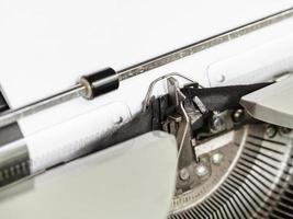 side view of typebar types ribbon in typewriter photo