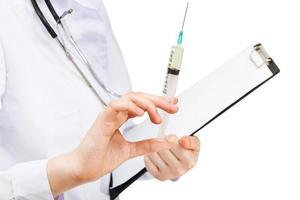 nurse holds syringe and clipboard isolated photo