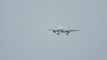 PHUKET, THAILAND DECEMBER 2, 2016 - Bangkok Air Airbus 319 HS PGT approaching before landing on the Phuket airport. View from the top floor of the hotel Centara Grand West Sands Resort Phuket video