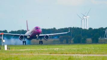 AMSTERDAM, THE NETHERLANDS JULY 26, 2017 - WOW Air Airbus 321 TF JOY landing on runway 18R Polderbaan. Shiphol Airport, Amsterdam, Holland video