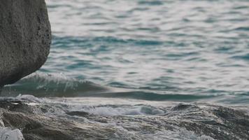 Turquoise waves rolled on the rocks, beach of Koh Miang island, Similan Islands, slow motion video