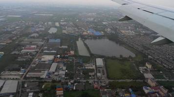 Airplane approaching during the rain at airport of Bangkok, Thailand video