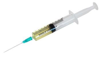 10 ml syringe filled with yellow infusion isolated photo