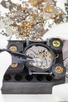 repairing of mechanical watch with spare parts photo