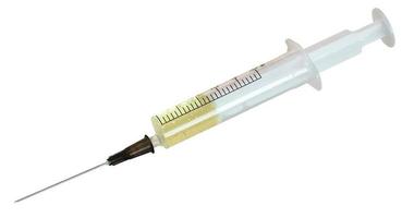 5 ml syringe filled with yellow infusion isolated photo