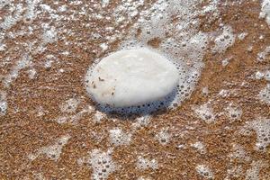 crystalline salt on beach of Dead Sea photo