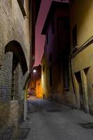 medieval street in Bologna at night photo