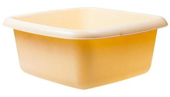 old yellow plastic rectangular wash basin isolated photo