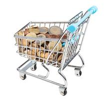 shopping trolley with euro coins isolated photo