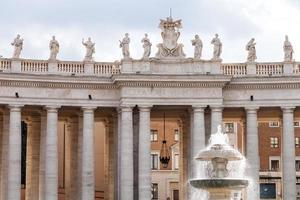 fountain and colonnade of St Peter's square photo