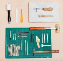 above view of various tools for leatherwork photo