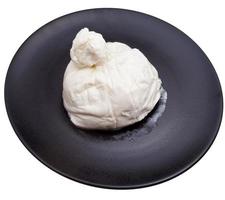 fresh italian cheese burrata on black ceramic plate photo