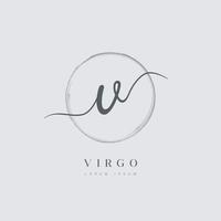 elegante logotipo de letra inicial tipo v con círculo cepillado vector