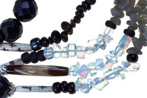 strings of transparent and black stone and bone bugles photo