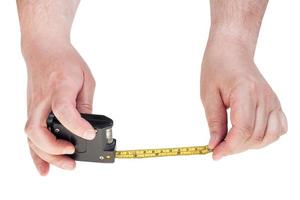 man hands with tape measure isolated photo