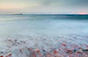 dry cargo ship in Red sea at night photo