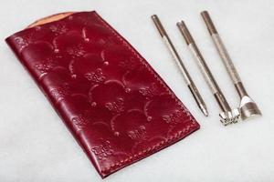 leather pouch for spectacle and embossing tools photo