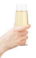 hand holds glass goblet with sparkling wine photo