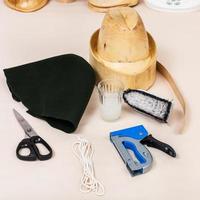 felt hood, wooden dummy and tools for millinery photo