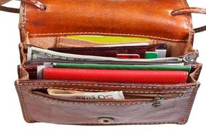 cash, credit cards, documents in small open purse photo