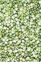 many raw green split peas photo