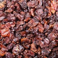 many dried red berberis fruits photo
