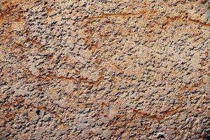 Detailed view on aged concrete walls with cracks and a lot of structure in high resolution photo