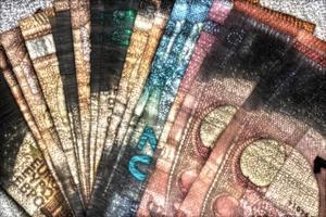 Illustration of glowing euro banknotes with a green kirlian aura around them. photo