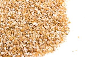 Pearl barley heap isolated on white photo