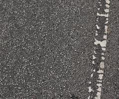 Detailed view on asphalt surfaces of different streets and roads with cracks photo