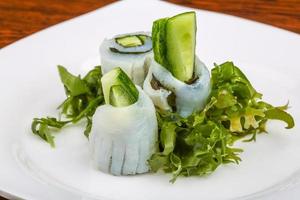 Squid sashimi on the plate and wooden background photo