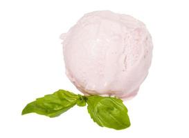 Scoop of strawberry ice cream from top on white background with mint leaf photo