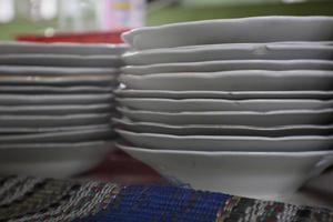 a pile of plates that are neatly arranged and attractive photo
