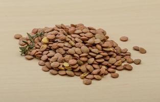 Dry Lentil on wooden background photo