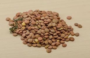 Dry Lentil on wooden background photo