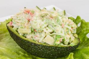 Crab meat salad with green caviar in avocado - japan cusine photo