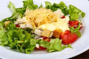 Caesar salad on the plate photo