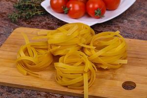 Raw pasta fettuccini photo