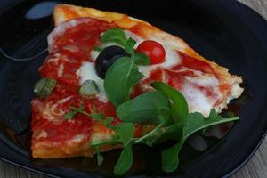 Pizza with salami and mozzarella photo