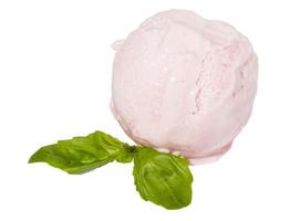 Scoop of strawberry ice cream from top on white background with mint leaf photo