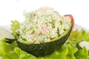 Crab meat salad with green caviar in avocado - japan cusine photo